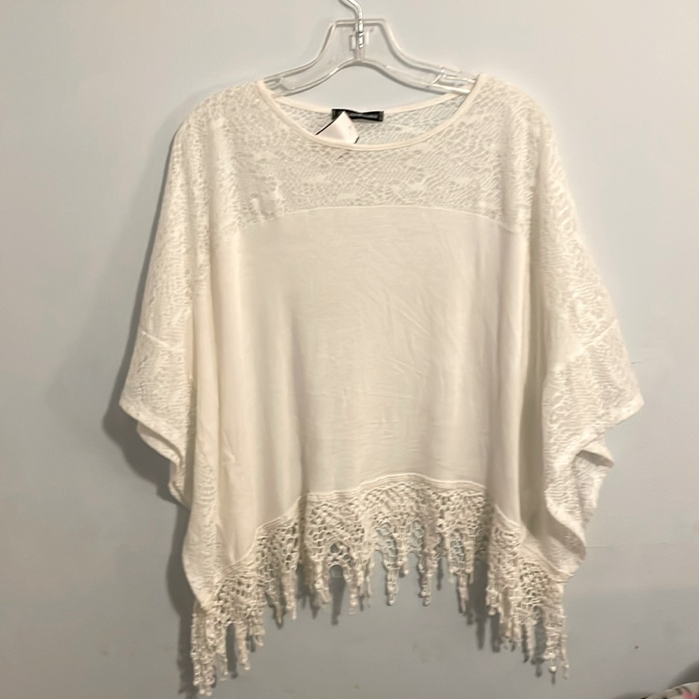 Beautiful off white loose blouse kinda half sleeve. So comfy and great for all.